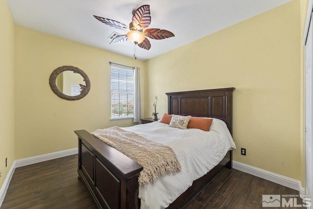 bedroom with dark wood finished floors, baseboards, and a ceiling fan