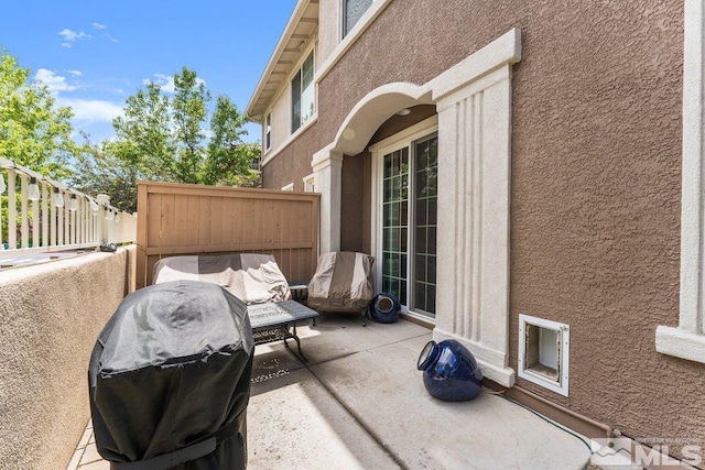 view of patio with fence and grilling area