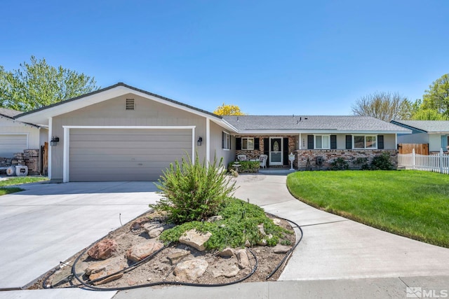 1509 Palo Verde, Carson City, NV 89703 - single story home with an attached garage, driveway, and brick siding