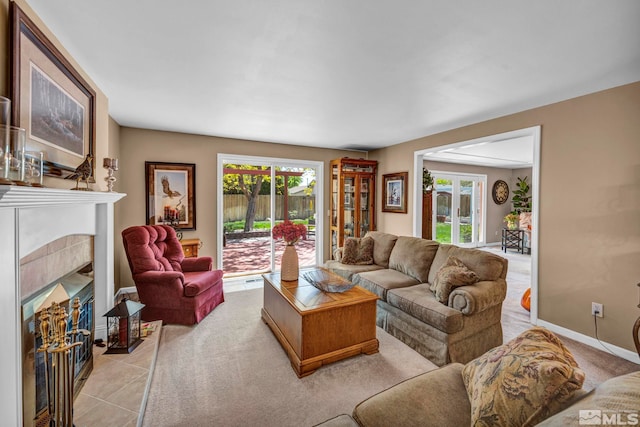 1509 Palo Verde, Carson City, NV 89703 - living area featuring plenty of natural light, a tiled fireplace, baseboards, and tile patterned flooring