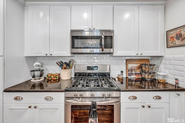 1509 Palo Verde, Carson City, NV 89703 - kitchen with stainless steel appliances, tasteful backsplash, white cabinets, and dark stone countertops