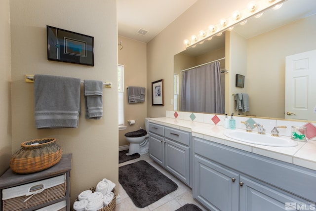 1082 Log Cabin Rd, Gardnerville, NV 89410 - bathroom with tile patterned floors, vanity, toilet, and a shower with shower curtain