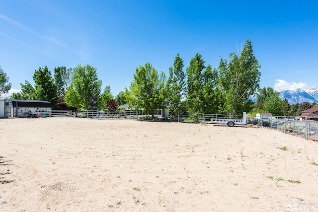 1082 Log Cabin Rd, Gardnerville, NV 89410 - surrounding community with an enclosed horse arena, fence, and a mountain view