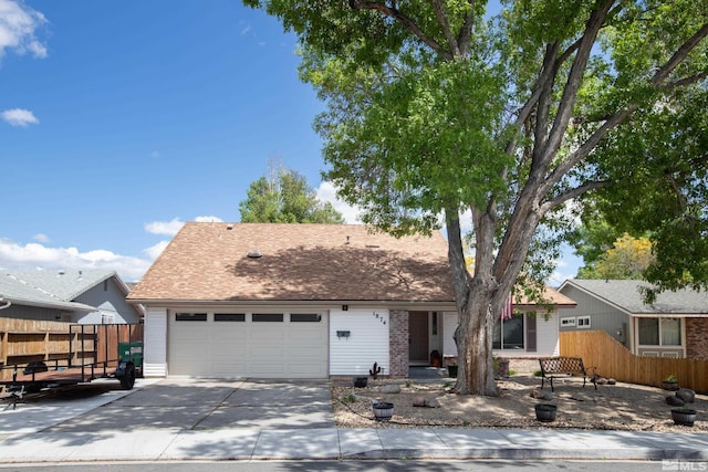 1874 Rosemary Dr, Sparks, NV 89434 - view of front facade featuring a garage, fence, driveway, and brick siding