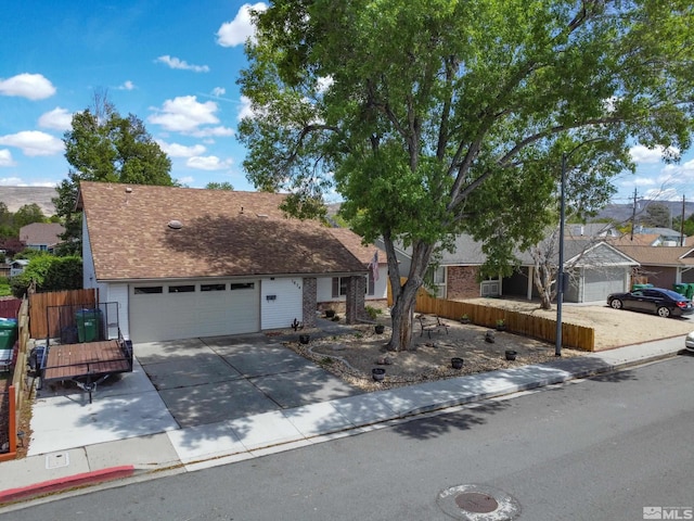 1874 Rosemary Dr, Sparks, NV 89434 - view of front of house with driveway, an attached garage, and fence