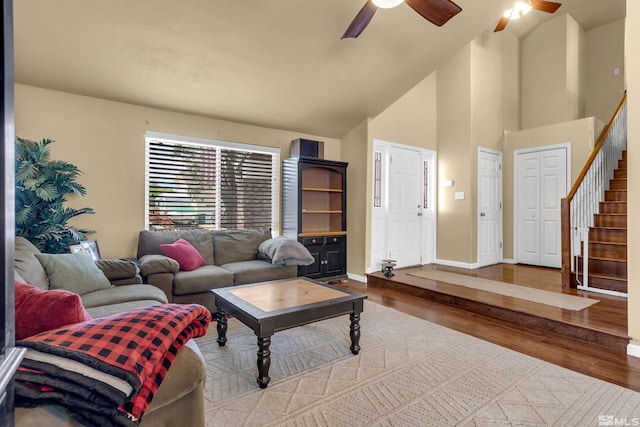 1874 Rosemary Dr, Sparks, NV 89434 - living room with a ceiling fan, wood finished floors, stairway, baseboards, and high vaulted ceiling