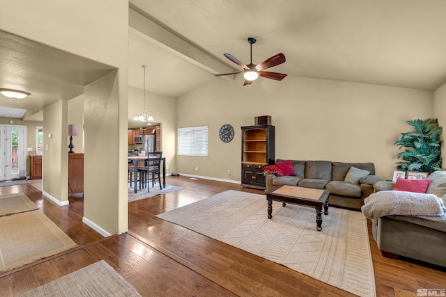 1874 Rosemary Dr, Sparks, NV 89434 - living area featuring wood finished floors, a ceiling fan, vaulted ceiling, baseboards, and a chandelier