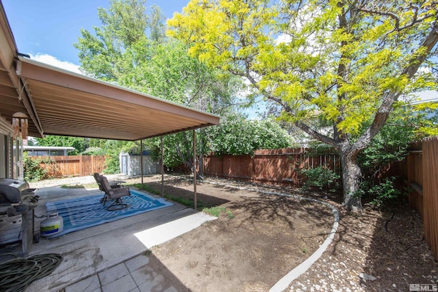 1874 Rosemary Dr, Sparks, NV 89434 - view of patio / terrace with a shed, a fenced backyard, and an outbuilding