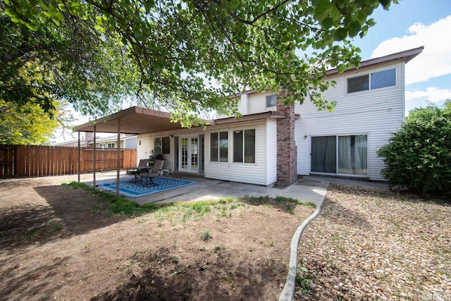 1874 Rosemary Dr, Sparks, NV 89434 - rear view of property featuring french doors, fence, and a patio