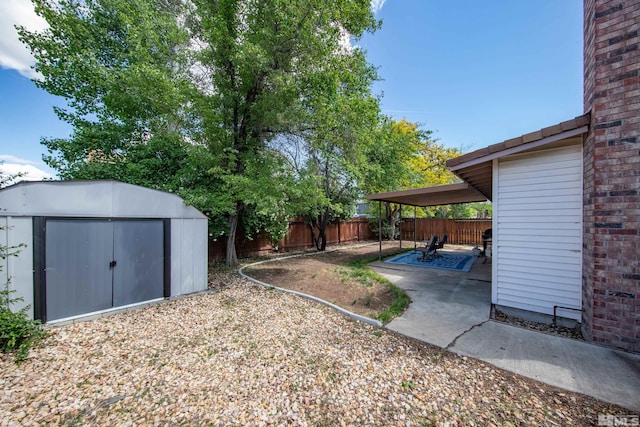 1874 Rosemary Dr, Sparks, NV 89434 - fenced backyard featuring a shed, a patio, and an outbuilding