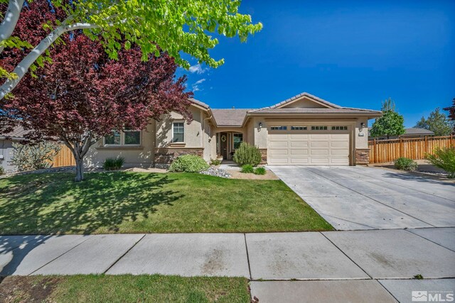 4184 Passage Dr, Sparks, NV 89436 - ranch-style home featuring a garage, driveway, stucco siding, and a tiled roof