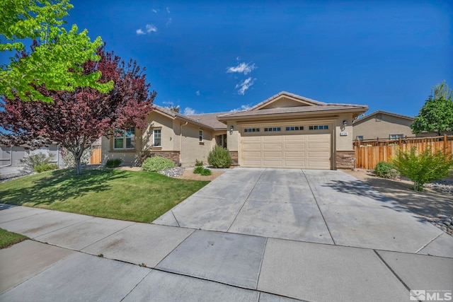 4184 Passage Dr, Sparks, NV 89436 - single story home featuring a garage, driveway, stucco siding, and stone siding