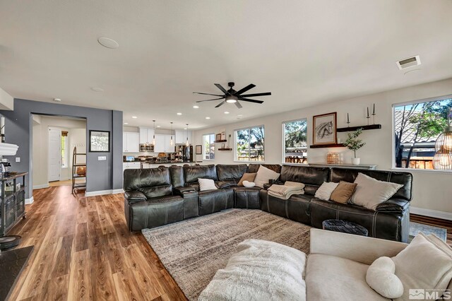 4184 Passage Dr, Sparks, NV 89436 - living area with ceiling fan, light wood-type flooring, healthy amount of natural light, baseboards, and recessed lighting