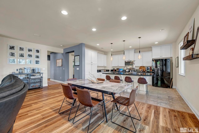4184 Passage Dr, Sparks, NV 89436 - dining space featuring baseboards, light wood-style flooring, and recessed lighting