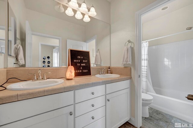 4184 Passage Dr, Sparks, NV 89436 - bathroom featuring toilet, double vanity, and shower / tub combo with curtain