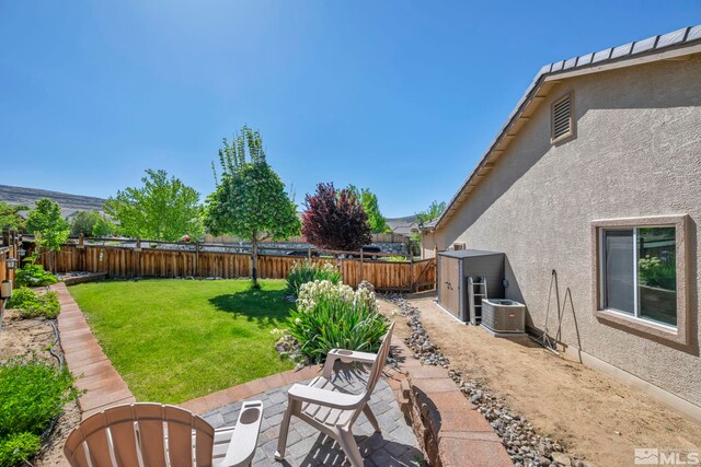 4184 Passage Dr, Sparks, NV 89436 - view of yard with central AC and a patio