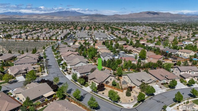 4184 Passage Dr, Sparks, NV 89436 - aerial overview of property's location with nearby suburban area and a mountainous background