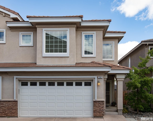 785 Sarcinella Ct, Reno, NV 89509 - townhome / multi-family property featuring a tiled roof, a garage, stucco siding, and driveway