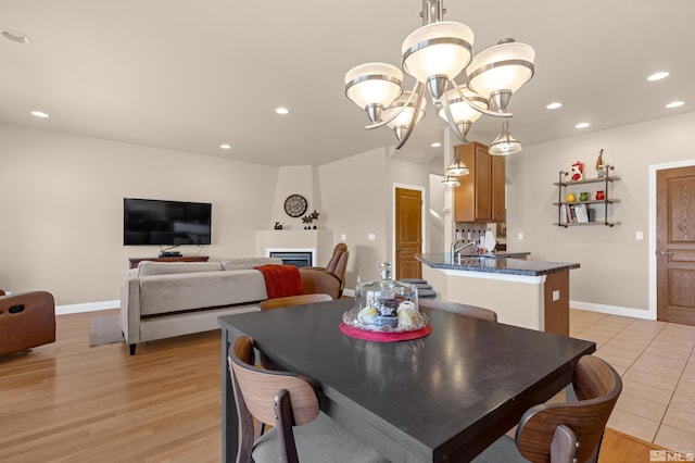 785 Sarcinella Ct, Reno, NV 89509 - dining space with recessed lighting, baseboards, light wood-style flooring, and a chandelier
