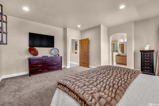 785 Sarcinella Ct, Reno, NV 89509 - carpeted bedroom with arched walkways, baseboards, recessed lighting, and connected bathroom