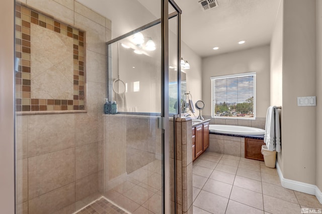785 Sarcinella Ct, Reno, NV 89509 - bathroom featuring tile patterned flooring, a bath, a stall shower, and vanity