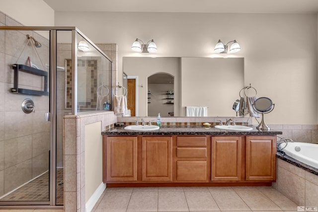 785 Sarcinella Ct, Reno, NV 89509 - full bathroom featuring tile patterned flooring, a shower stall, a bath, and double vanity