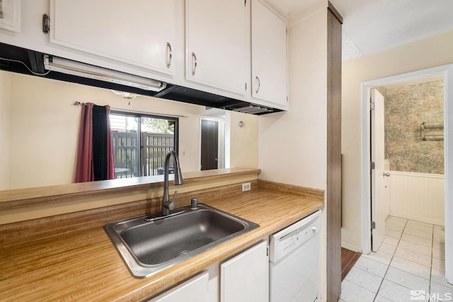 4545 Reggie Rd, Reno, NV 89502 - kitchen with a sink, dishwasher, white cabinets, light countertops, and light tile patterned floors