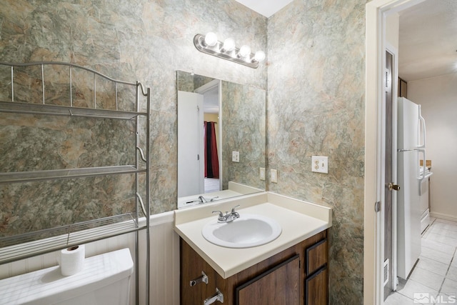 4545 Reggie Rd, Reno, NV 89502 - bathroom featuring vanity, tile patterned flooring, toilet, and tile walls