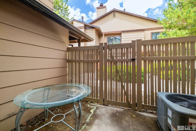 4545 Reggie Rd, Reno, NV 89502 - view of patio / terrace featuring central AC unit, a gate, and fence