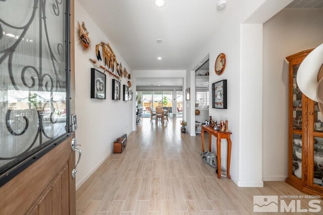 9680 Thesolious Ln, Reno, NV 89521 - hallway featuring light wood-type flooring, baseboards, and recessed lighting