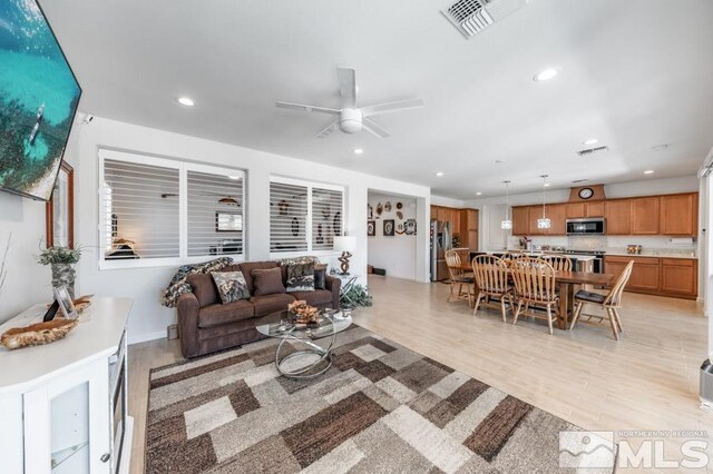 9680 Thesolious Ln, Reno, NV 89521 - living room with a ceiling fan, recessed lighting, and light wood-type flooring