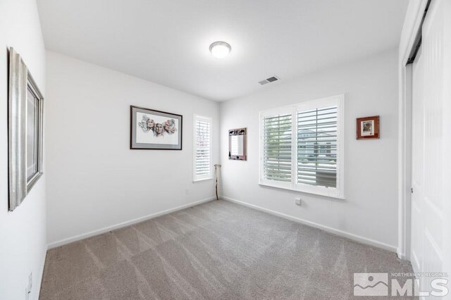 9680 Thesolious Ln, Reno, NV 89521 - unfurnished bedroom featuring carpet floors and baseboards