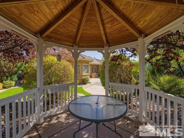 wooden deck featuring a gazebo