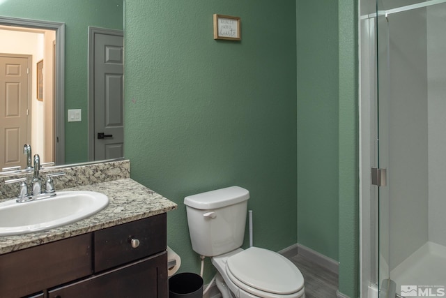 8139 Dornoch Dr, Reno, NV 89439 - full bath with a stall shower, toilet, vanity, and wood finished floors
