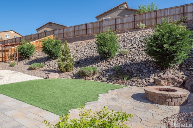 8139 Dornoch Dr, Reno, NV 89439 - view of yard with an outdoor fire pit and a patio