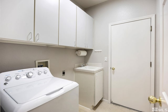 clothes washing area with washer / clothes dryer, cabinet space, and light tile patterned floors