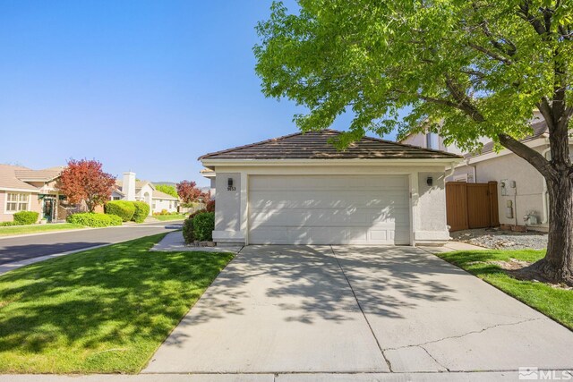 view of front of property featuring driveway, stucco siding, and a residential view