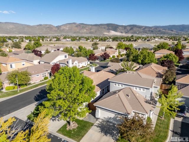 aerial view of residential area featuring mountains