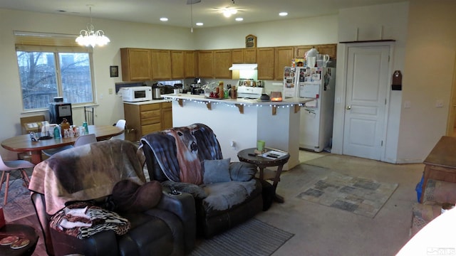 201 Crown Point Dr, Dayton, NV 89403 - kitchen featuring white appliances, extractor fan, brown cabinets, recessed lighting, and decorative light fixtures