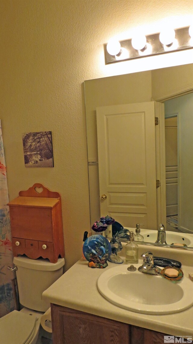 201 Crown Point Dr, Dayton, NV 89403 - bathroom with vanity and toilet