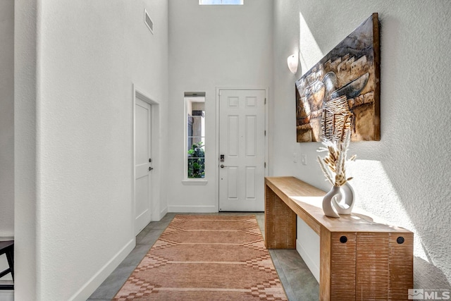 103 Pilot Peak, Carson City, NV 89701 - foyer featuring baseboards, a high ceiling, and a textured wall