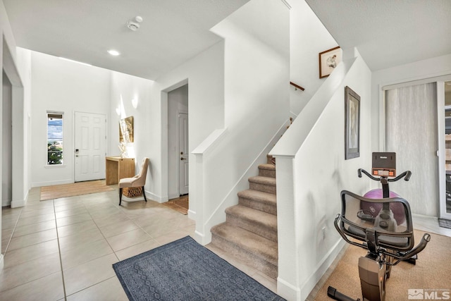 103 Pilot Peak, Carson City, NV 89701 - entrance foyer with stairway, light tile patterned floors, baseboards, and recessed lighting