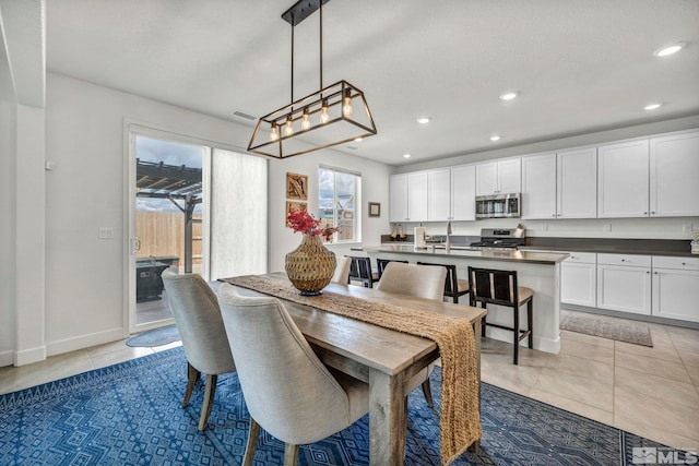 103 Pilot Peak, Carson City, NV 89701 - dining room with light tile patterned floors, recessed lighting, baseboards, and a chandelier