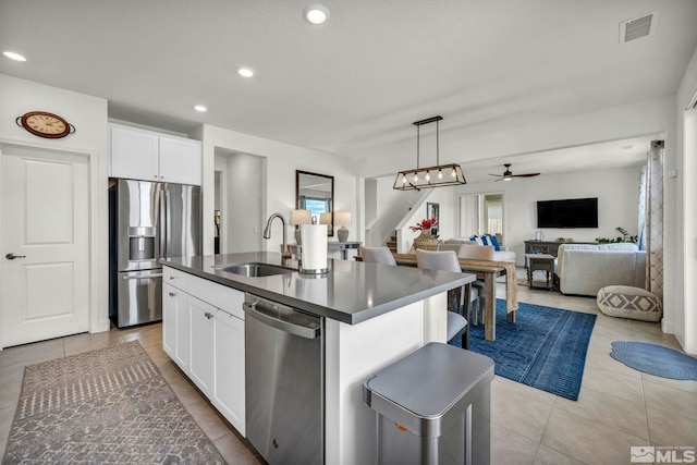 103 Pilot Peak, Carson City, NV 89701 - kitchen featuring appliances with stainless steel finishes, a sink, dark countertops, white cabinetry, and recessed lighting