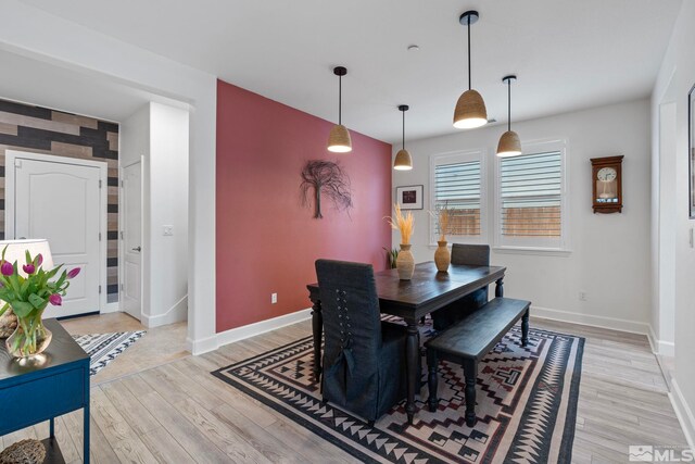 3097 Livorno Dr, Sparks, NV 89434 - dining space featuring light wood-style flooring, baseboards, and an accent wall