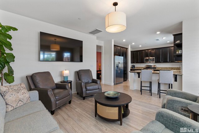 3097 Livorno Dr, Sparks, NV 89434 - living area with light wood-style flooring and recessed lighting