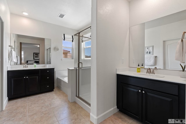 3097 Livorno Dr, Sparks, NV 89434 - full bathroom featuring a shower stall, tile patterned flooring, and two vanities