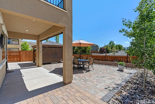 3097 Livorno Dr, Sparks, NV 89434 - view of patio / terrace with a gazebo, a fenced backyard, and outdoor dining area