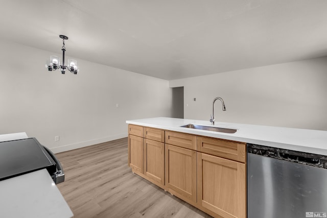 745 Jamaica Ave Unit 4, Reno, NV 89502 - kitchen with stainless steel dishwasher, a sink, light countertops, and light wood-style floors