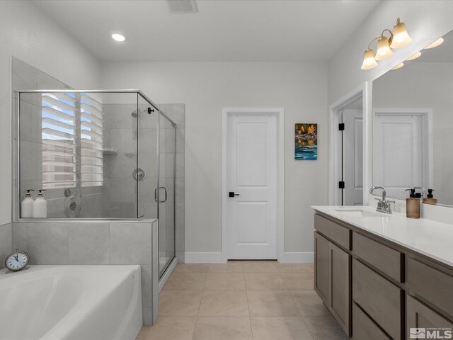 bathroom featuring a shower stall, a garden tub, vanity, tile patterned floors, and recessed lighting